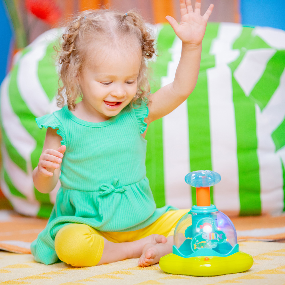 BRIGHT STARTS Hračka hudobná svietiaca Press&amp;Glow Spinner 6m+