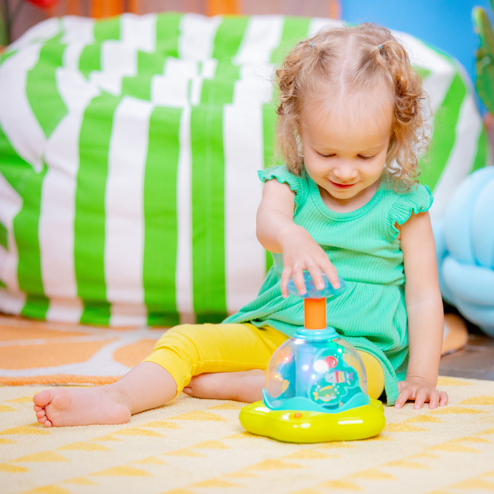 BRIGHT STARTS Hračka hudobná svietiaca Press&amp;Glow Spinner 6m+