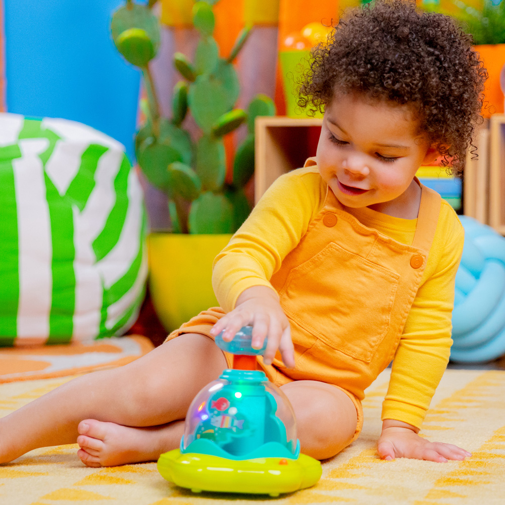 BRIGHT STARTS Hračka hudobná svietiaca Press&amp;Glow Spinner 6m+