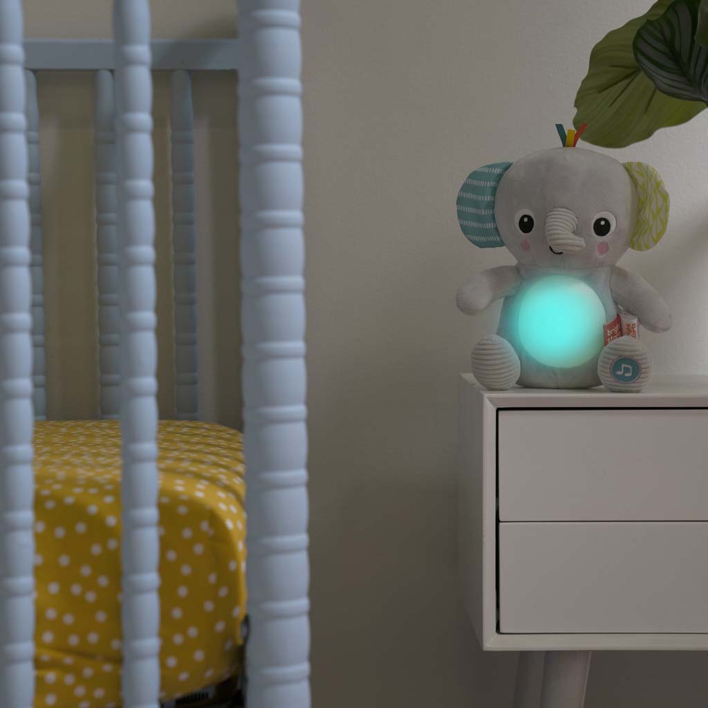 BRIGHT STARTS Hračka plyšová hudobná svietiaca Hug-a-bye Baby™ sloník 0m+