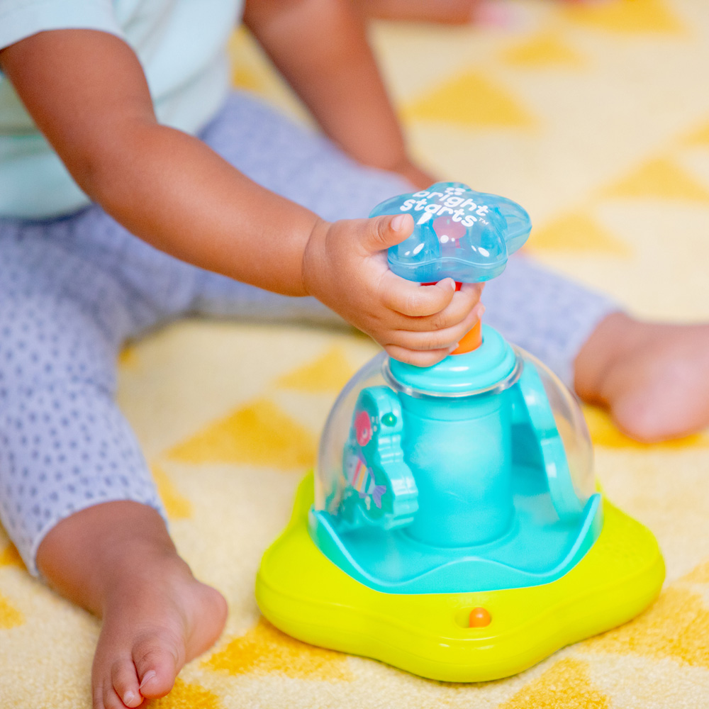 BRIGHT STARTS Hračka hudobná svietiaca Press&amp;Glow Spinner 6m+
